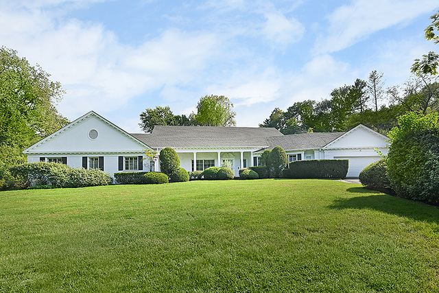 115 Woodley Road Winnetka, IL 60093 - Photo 1 of 41 a front view of house with yard and green space
