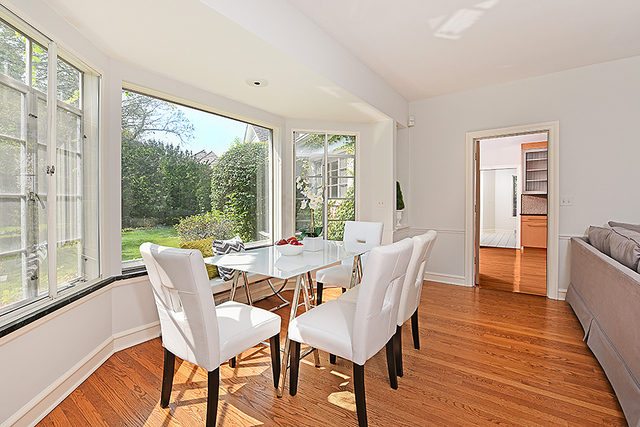 115 Woodley Road Winnetka, IL 60093 - Photo 14 of 41 a view of a dining room with furniture window and wooden floor