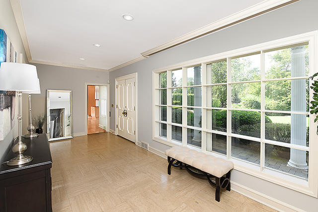 115 Woodley Road Winnetka, IL 60093 - Photo 3 of 41 a view of a livingroom with a large window