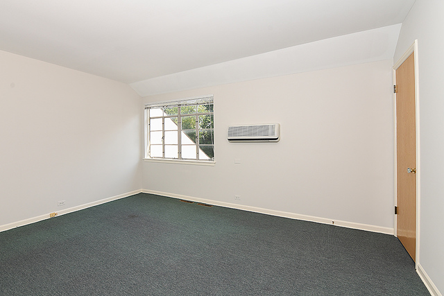 115 Woodley Road Winnetka, IL 60093 - Photo 34 of 41 an empty room with a window