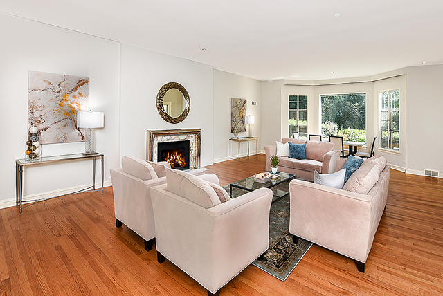 115 Woodley Road Winnetka, IL 60093 - Photo 5 of 41 a living room with furniture and a fireplace