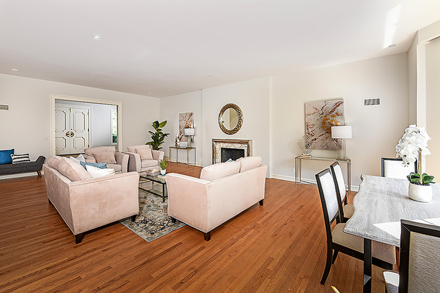 115 Woodley Road Winnetka, IL 60093 - Photo 6 of 41 a living room with fireplace furniture and a wooden floor