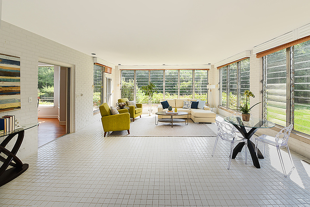 115 Woodley Road Winnetka, IL 60093 - Photo 9 of 41 a living room with furniture and floor to ceiling windows