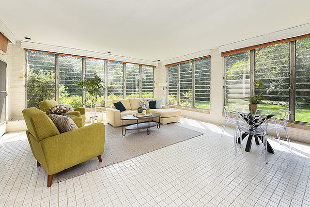 115 Woodley Road Winnetka, IL 60093 - Photo 10 of 41 a living room with furniture and a large window with balcony view