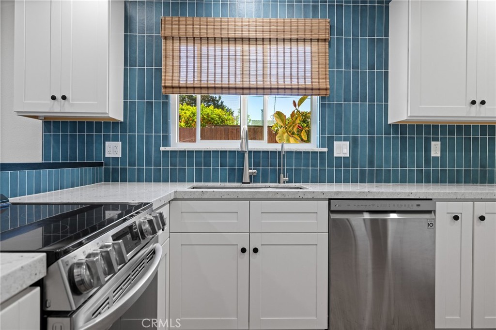 131 Gemini Street Lompoc, CA 93436 - Photo 10 of 30 a kitchen that has a sink and a stove