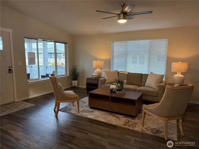 a living room with furniture and a lamp