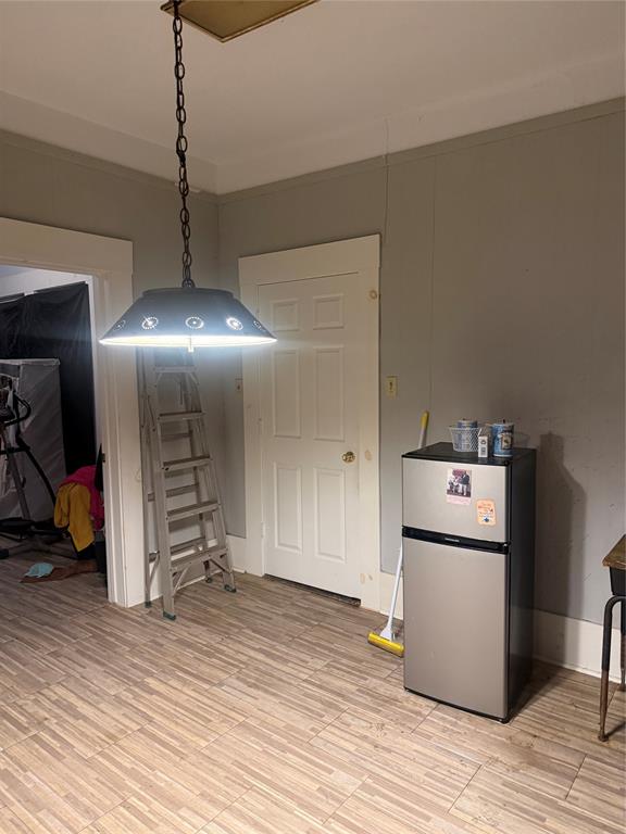 1304 North 22nd Street Waco, TX 76707 - Photo 3 of 6 a view of a refrigerator in kitchen and a wooden floor