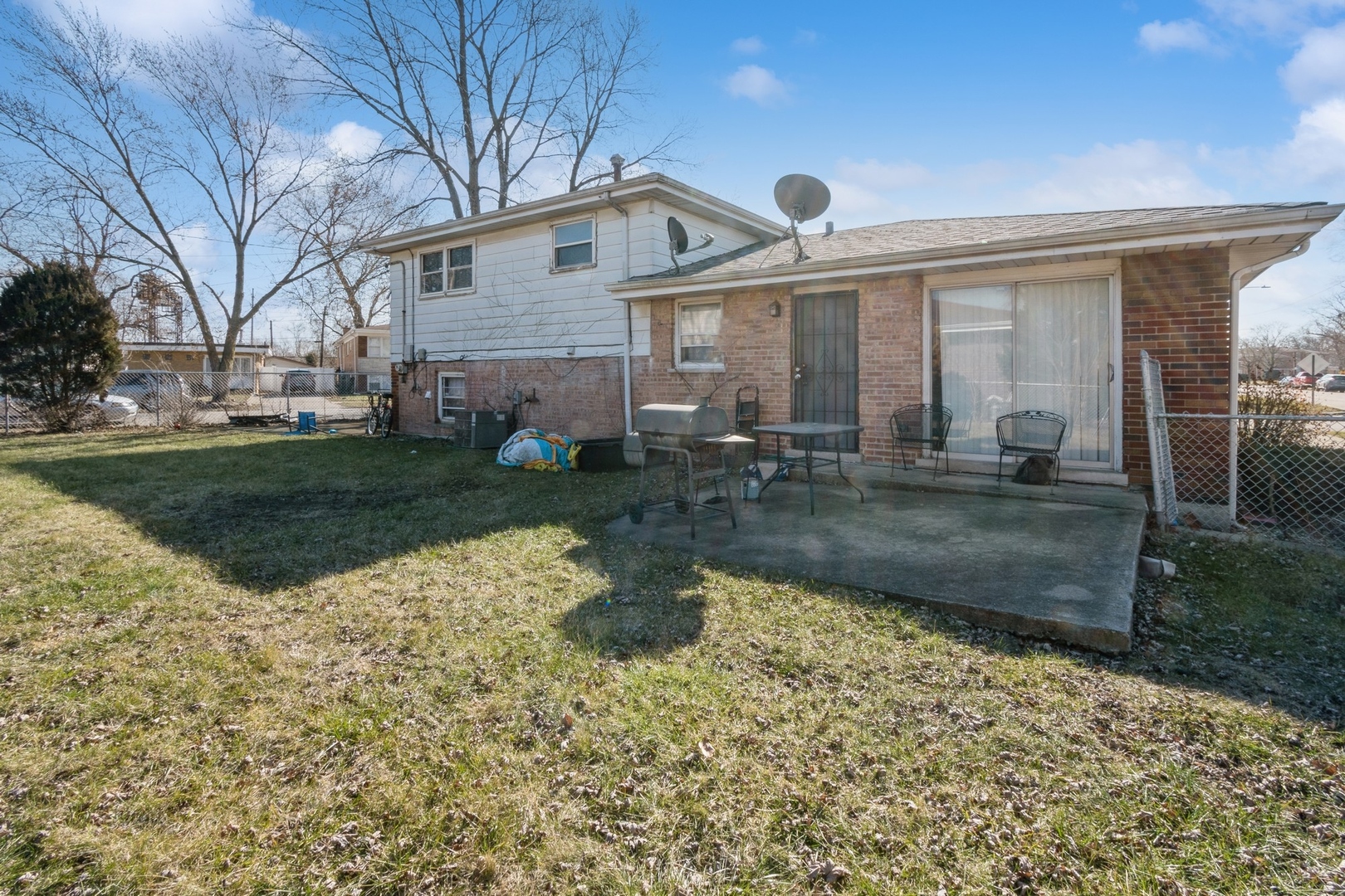 14321 Normal Avenue Harvey, IL 60426 - Photo 9 of 9 a front view of a house with garden