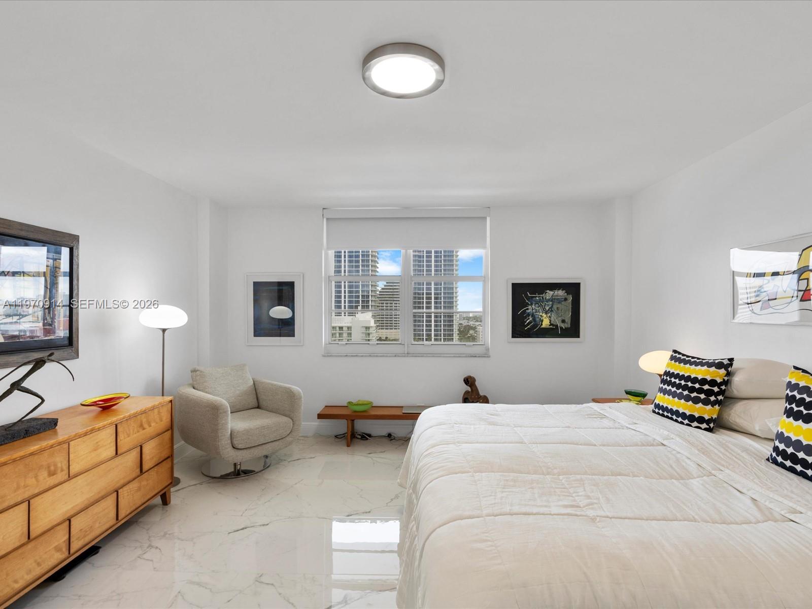 336 North Birch Road, Unit PH Fort Lauderdale, FL 33304 - Photo 23 of 68 a bedroom with bed and window
