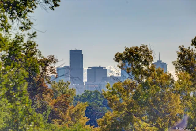 a picture of a bench in front of a wall