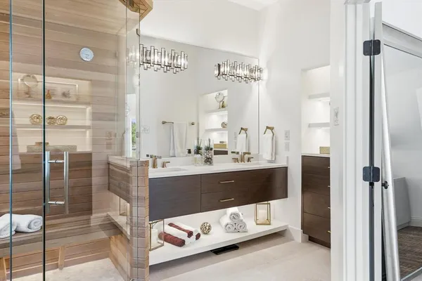 a bathroom with a tub sink and shower