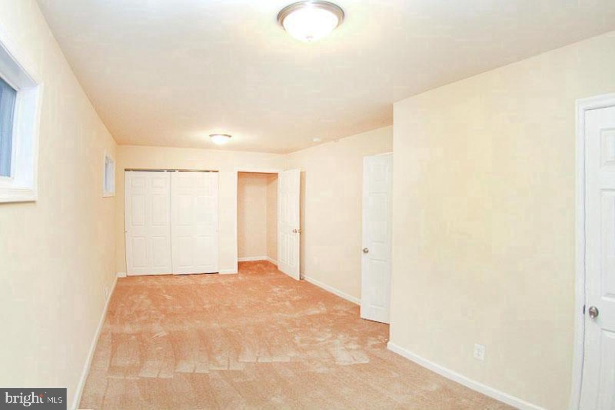14 Cedar Hill Road Brooklyn, MD 21225 - Photo 4 of 10 a view of a livingroom with wooden floor and a window