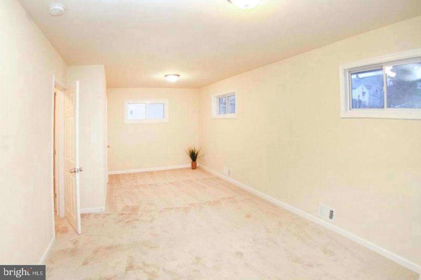 14 Cedar Hill Road Brooklyn, MD 21225 - Photo 5 of 10 an empty room with a bathroom
