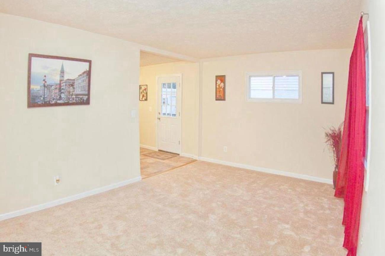 14 Cedar Hill Road Brooklyn, MD 21225 - Photo 6 of 10 a view of an empty room with a window