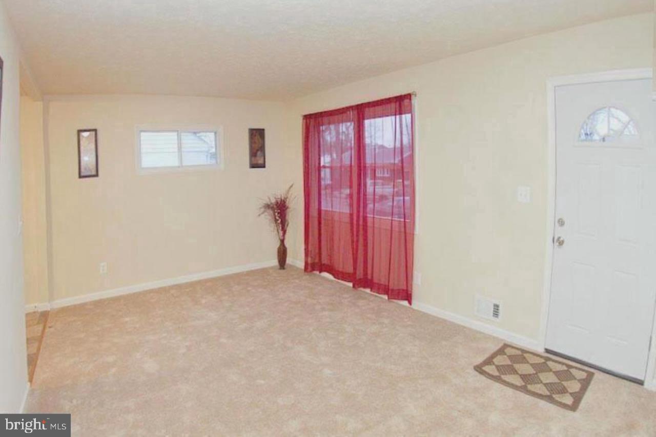 14 Cedar Hill Road Brooklyn, MD 21225 - Photo 7 of 10 a view of an empty room