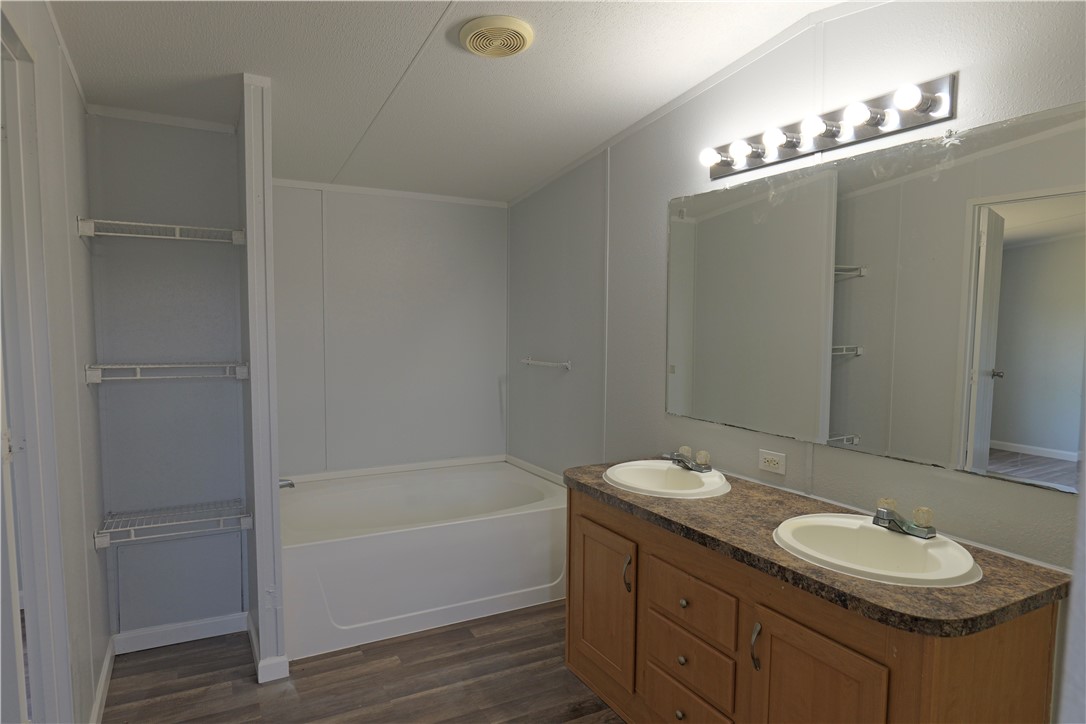 732 C Rogers Street Normangee, TX 77871 - Photo 7 of 10 a bathroom with a sink and a mirror