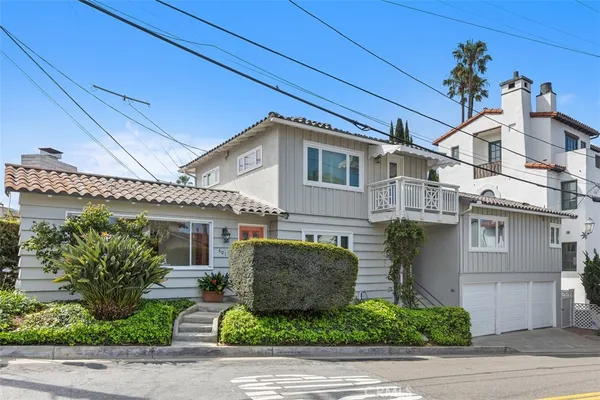 a front view of a house with garage