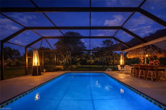 a view of a swimming pool with an outdoor seating