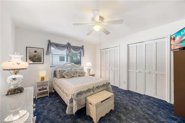 a view of a lake with boats and trees in the background