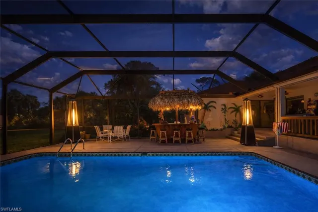 a view of a garden with a table and a lake view