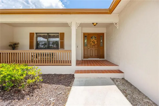 a view of a house with a small yard