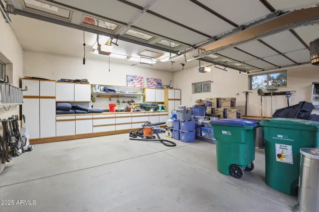 a room with lots of wooden furniture and a chandelier