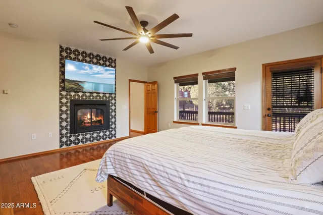 a bedroom with a bed and a fireplace