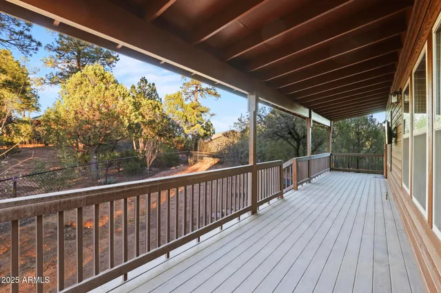 a view of balcony with wooden floor