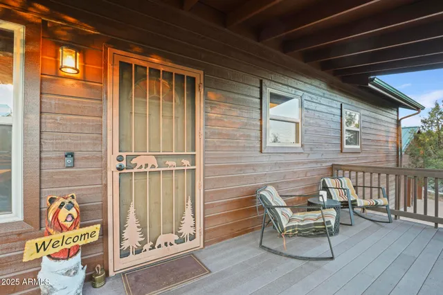 a balcony with table and chairs