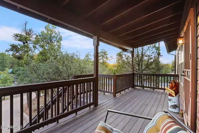 a view of a two chairs in the balcony