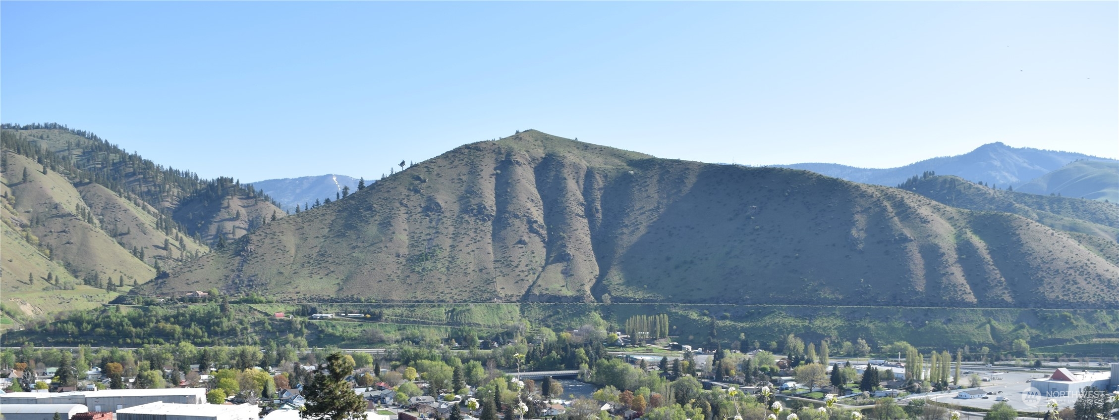 124 Freedom Hills Cashmere, WA 98815 - Photo 15 of 27 a view of a street with a building in the background