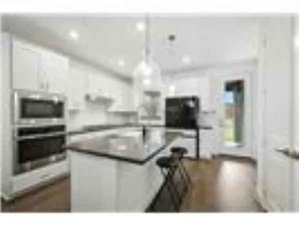 a view of living room with furniture and flat screen tv
