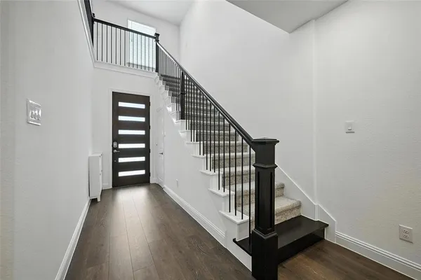 a view of a hallway with staircase