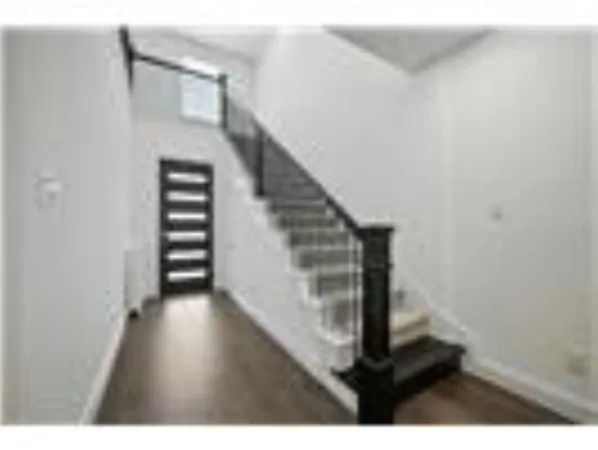 a view of entryway with wooden floor