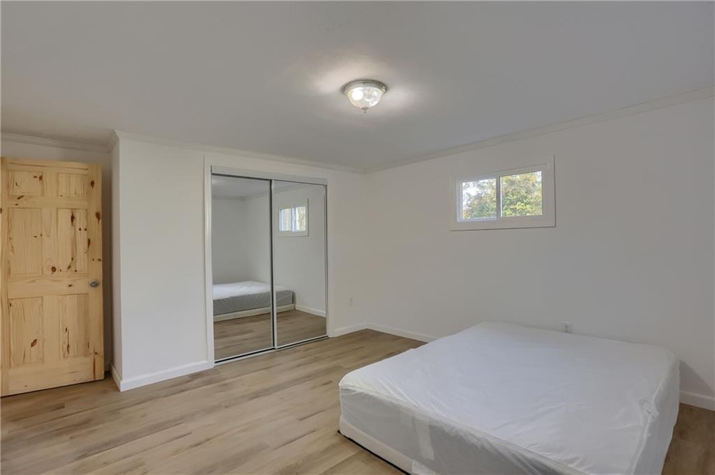 155 Dutchtown Road Butler, PA 16002 - Photo 12 of 34 an empty room with wooden floor and windows
