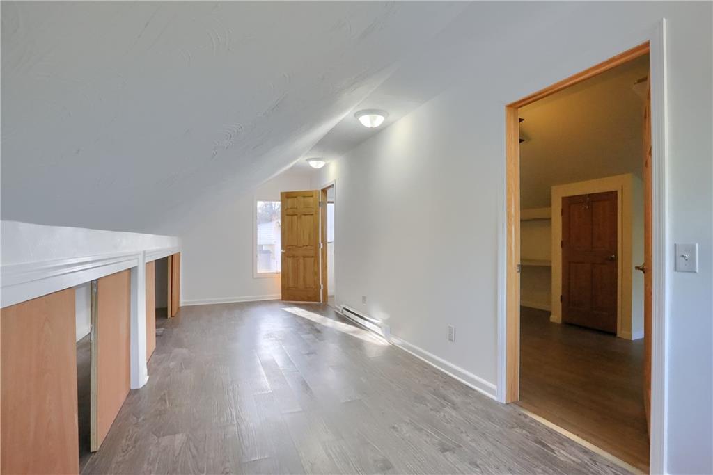 155 Dutchtown Road Butler, PA 16002 - Photo 23 of 34 a view of an empty room with window and wooden floor