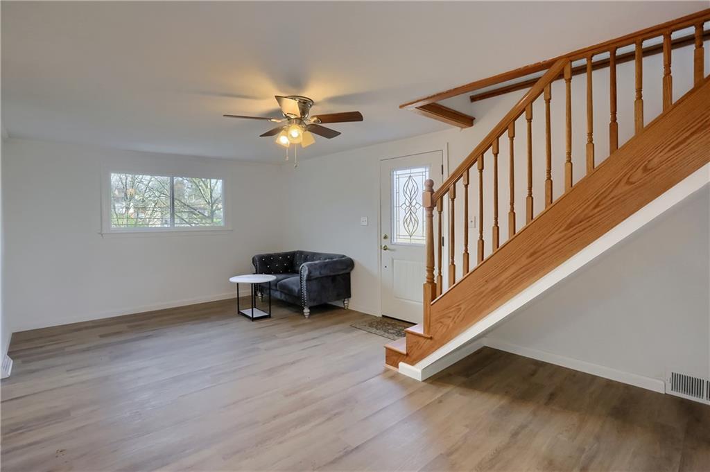 155 Dutchtown Road Butler, PA 16002 - Photo 4 of 34 a view of an empty room with wooden floor and a window