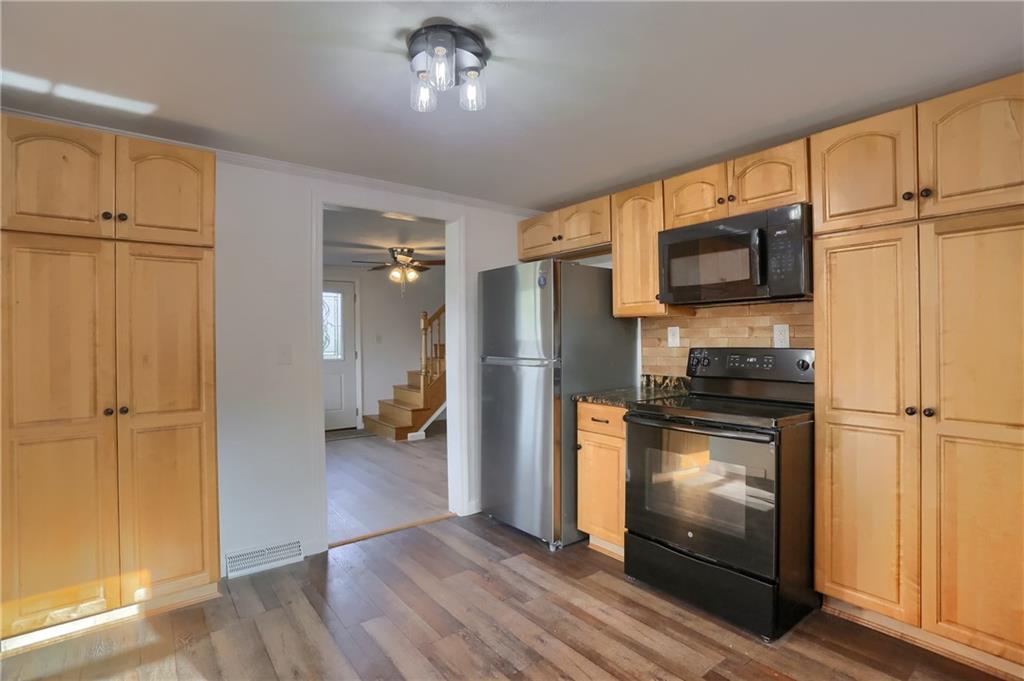 155 Dutchtown Road Butler, PA 16002 - Photo 6 of 34 a kitchen with a refrigerator cabinet and a microwave