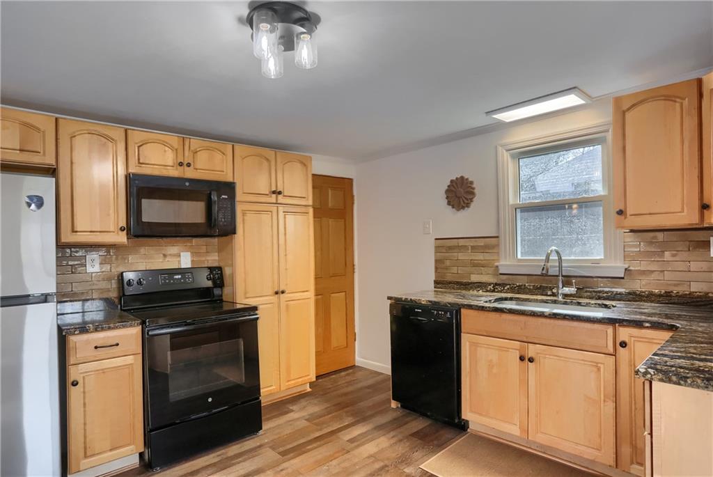 155 Dutchtown Road Butler, PA 16002 - Photo 7 of 34 a kitchen with stainless steel appliances a stove sink microwave and refrigerator