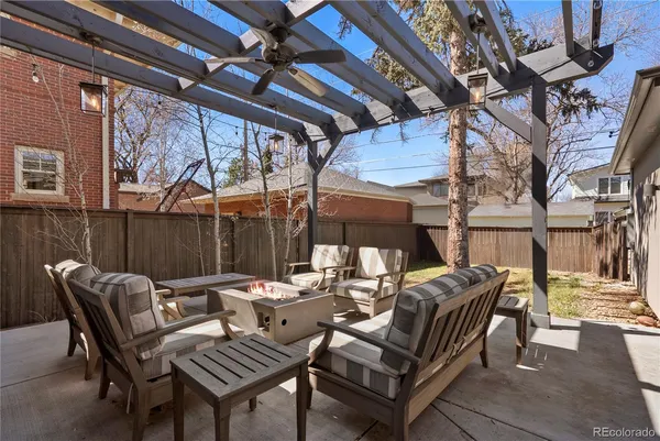 a view of a patio with a table and chairs