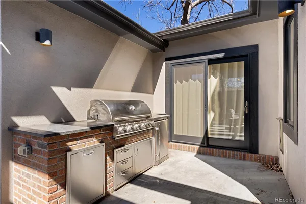 a view of water heater room with stove