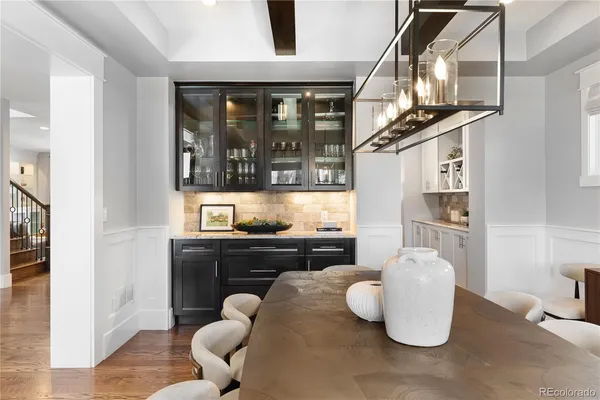 a kitchen with a refrigerator and a sink