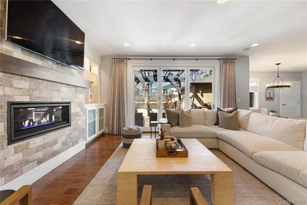 a living room with furniture fireplace and a flat screen tv