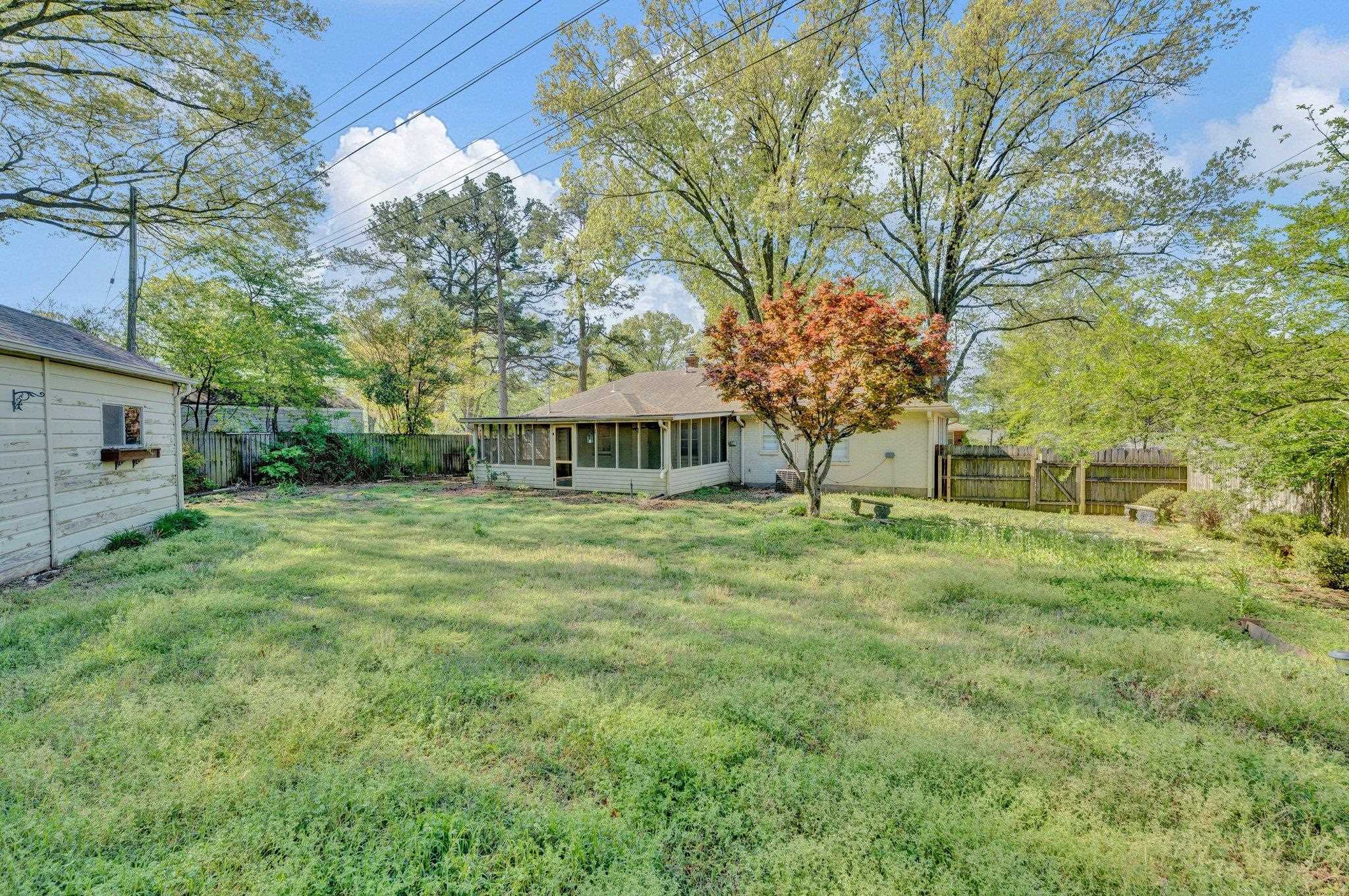 5176 Verne Road Memphis, TN 38117 - Photo 27 of 28 View of yard featuring a fenced backyard and a sunroom