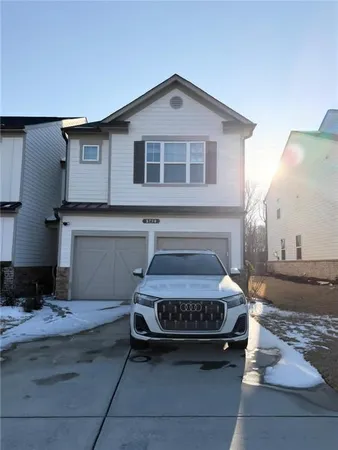 a car parked in front of a house