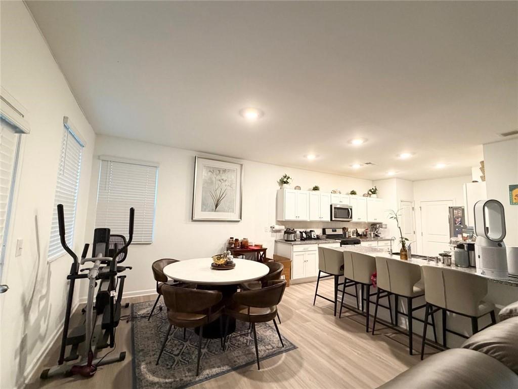 5790 Flint Lane Cumming, GA 30028 - Photo 13 of 40 a view of a dining room with furniture