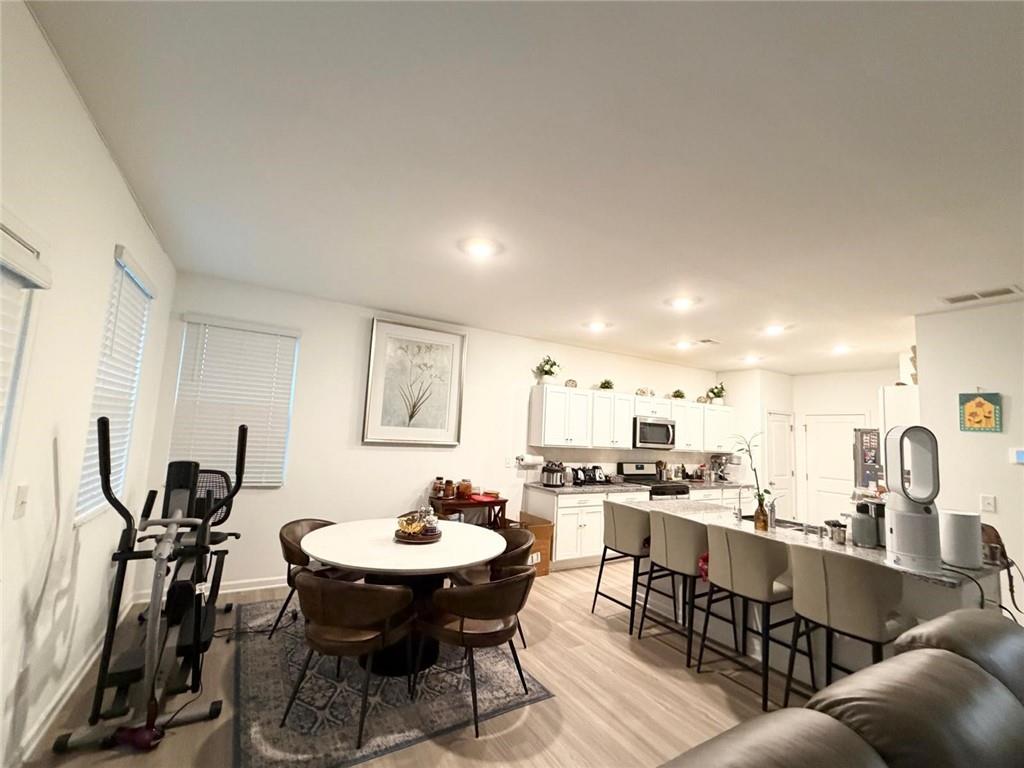 5790 Flint Lane Cumming, GA 30028 - Photo 14 of 40 a view of a dining room with furniture