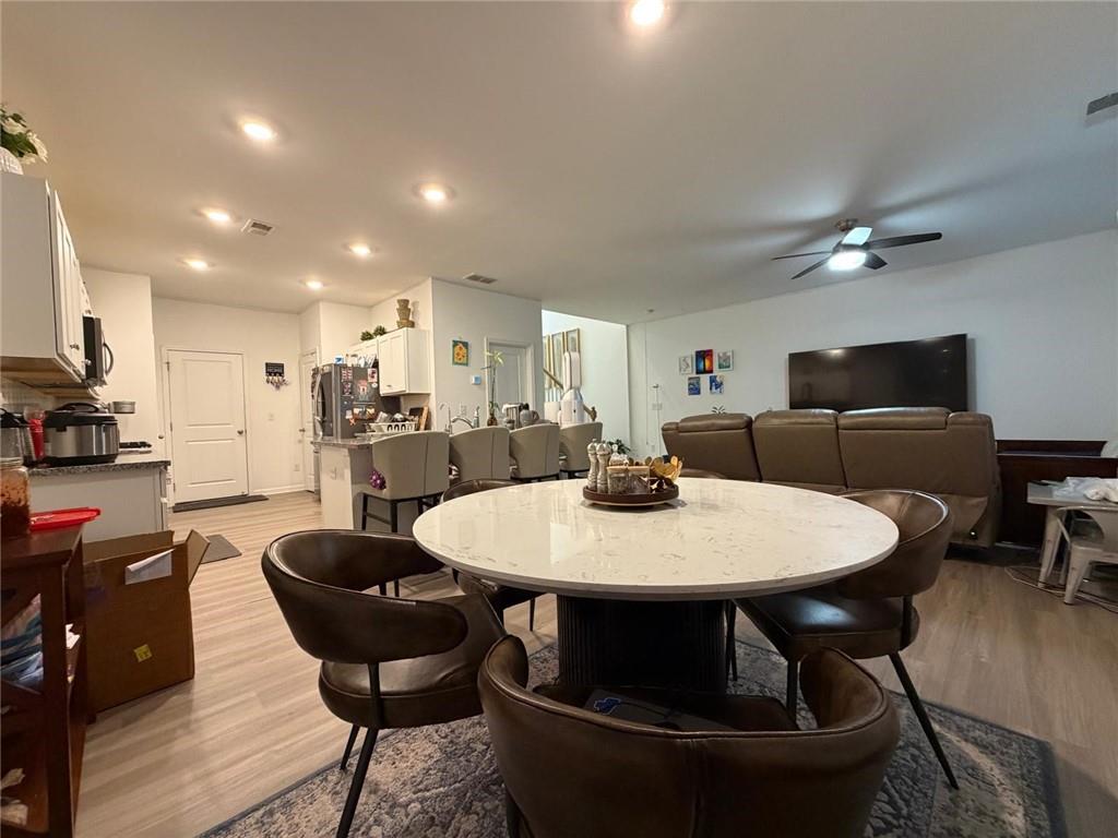 5790 Flint Lane Cumming, GA 30028 - Photo 15 of 40 a view of a dining room with furniture