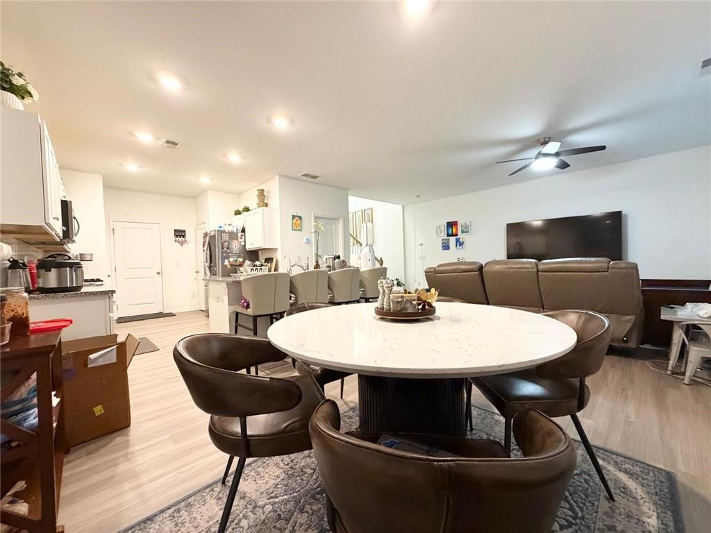 5790 Flint Lane Cumming, GA 30028 - Photo 16 of 40 a view of a dining room with furniture