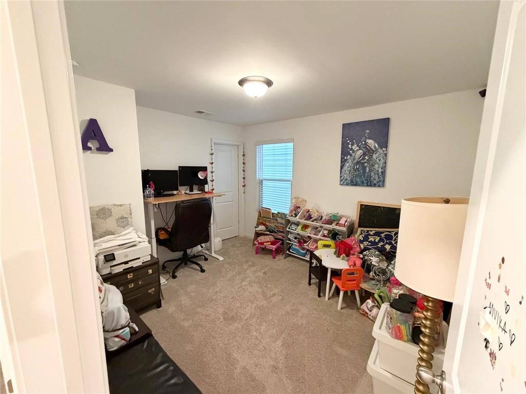 5790 Flint Lane Cumming, GA 30028 - Photo 17 of 40 a view of a workspace with furniture and a window